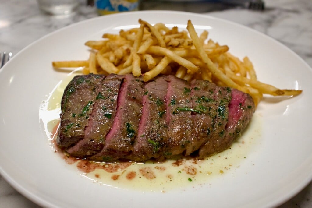 slices of pink grilled Steak with fries