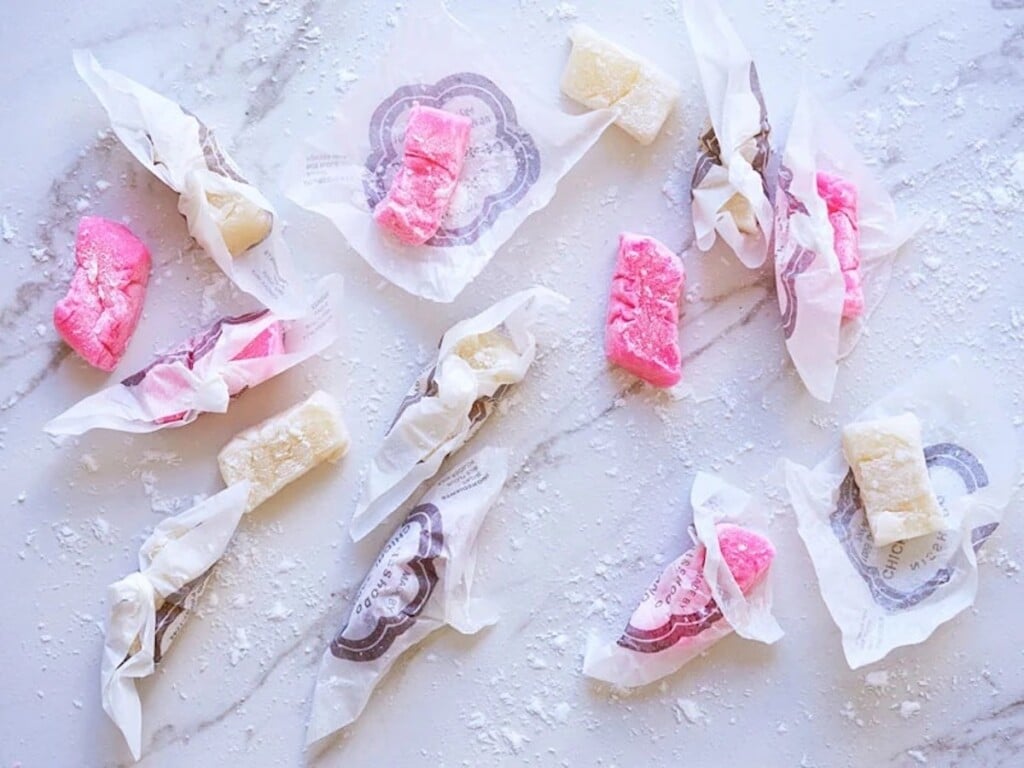 pink and white chichi dango mochi in wrappers