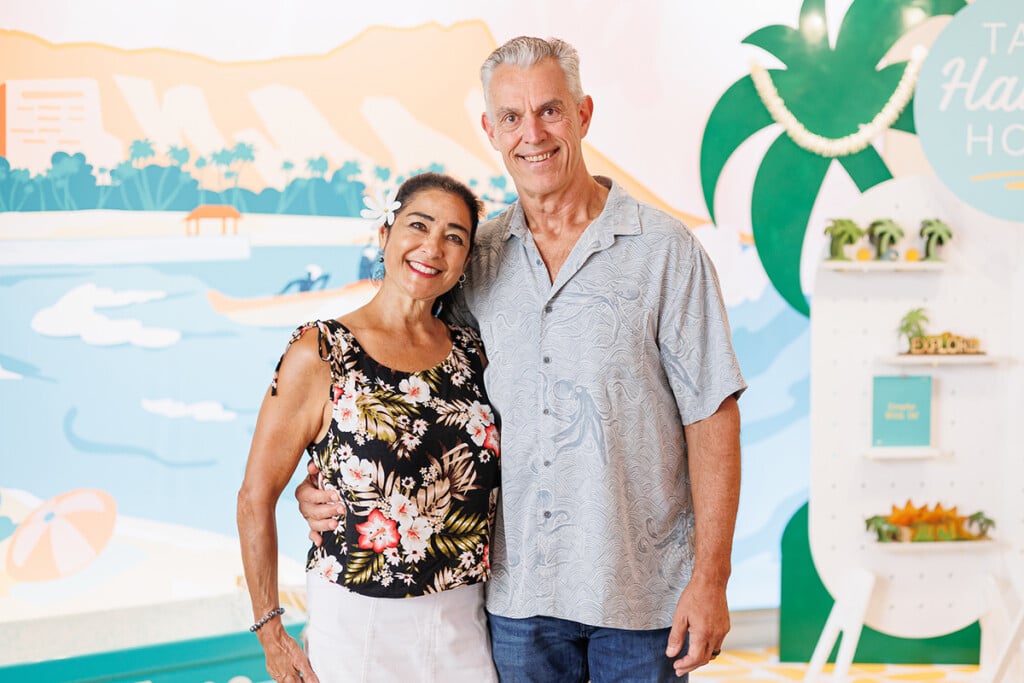 man and woman standing in boutique