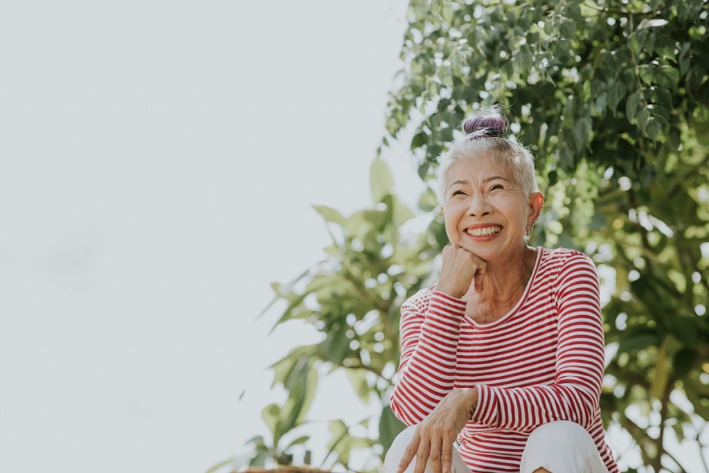 Thai Senior Hipster Portrait Beside The Garden